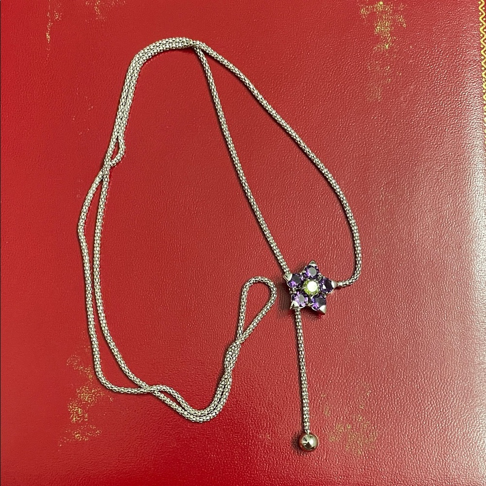 18k white gold lariat style necklace with an amethyst and peridot flower